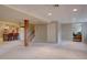 Open basement with a wet bar, seating, and potential for customization at 24556 E Ottawa Ave, Aurora, CO 80016