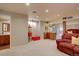 Finished basement area featuring a wet bar and a classic popcorn machine at 24556 E Ottawa Ave, Aurora, CO 80016
