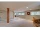 Spacious finished basement area offering natural light and neutral carpeting at 24556 E Ottawa Ave, Aurora, CO 80016