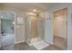 Bathroom boasts a tiled shower and a view into the main bedroom at 24556 E Ottawa Ave, Aurora, CO 80016