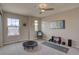 Bonus room featuring a trampoline, yoga mat, weights, and natural light at 24556 E Ottawa Ave, Aurora, CO 80016
