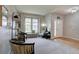 Welcoming foyer with neutral carpet and walls, stylish decor, and a view of the front door at 24556 E Ottawa Ave, Aurora, CO 80016