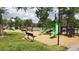 Community playground with a variety of slides, climbing structures, and benches provides a safe and fun space at 24556 E Ottawa Ave, Aurora, CO 80016