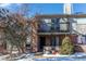 Front view of a brick townhouse, showing the entrance and balcony at 4206 S Granby St # E, Aurora, CO 80014