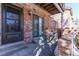 Cozy brick patio with access to the backyard and a view of the tennis court at 4206 S Granby St # E, Aurora, CO 80014