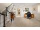 Finished basement with carpeted floor, desk/office area, and access to upper level via stairs at 355 Steele St, Denver, CO 80206