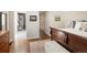 View of ensuite bathroom from bedroom featuring hardwood floors and classic design at 355 Steele St, Denver, CO 80206