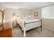 Bedroom with neutral walls, carpeted floor, metal bed frame, and side tables with lamps at 355 Steele St, Denver, CO 80206