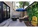Serene courtyard with a fire pit, seating area and lush landscaping at 355 Steele St, Denver, CO 80206