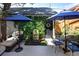 Private courtyard with a water fountain, seating, and lush greenery at 355 Steele St, Denver, CO 80206