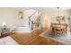 Grand foyer with hardwood floors, staircase, and dining room at 355 Steele St, Denver, CO 80206