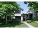 Charming two-story home with a manicured lawn and mature trees, offering curb appeal at 355 Steele St, Denver, CO 80206