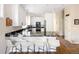 Kitchen featuring a bar and an open concept at 355 Steele St, Denver, CO 80206