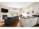 Cozy living space featuring a fireplace and an adjacent wet bar at 355 Steele St, Denver, CO 80206