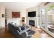 Living room featuring a fireplace and a walkout to the back courtyard at 355 Steele St, Denver, CO 80206