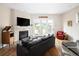 Cozy living room with fireplace, hardwood floors and sliding doors to the patio at 355 Steele St, Denver, CO 80206