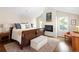 Comfortable main bedroom featuring natural light and a cozy fireplace at 355 Steele St, Denver, CO 80206