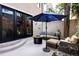 Charming patio featuring comfortable seating, an umbrella, and an inviting fire pit at 355 Steele St, Denver, CO 80206