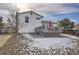 House back elevation with deck and fenced backyard at 8604 Barberry Pl, Parker, CO 80134