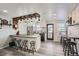 Updated kitchen with island, wood accents, and farmhouse style at 8604 Barberry Pl, Parker, CO 80134