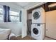 Stackable washer and dryer in a laundry closet at 8604 Barberry Pl, Parker, CO 80134