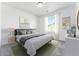 Neutral bedroom with modern decor, a large window, and plush carpet at 2070 Wagon Wheel Aly, Brighton, CO 80601