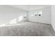 Bright bedroom with three large windows and neutral carpet, creating a calm atmosphere at 2070 Wagon Wheel Aly, Brighton, CO 80601
