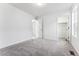 A well-lit bedroom features neutral walls, plush carpeting, and easy access to both closet and hallway at 2070 Wagon Wheel Aly, Brighton, CO 80601