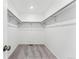 A spacious walk-in closet featuring ample shelving and closet rod for optimal storage solutions at 2070 Wagon Wheel Aly, Brighton, CO 80601
