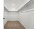 A walk-in closet features carpeted floors and a shelf for organization at 2070 Wagon Wheel Aly, Brighton, CO 80601