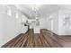 Spacious kitchen with white cabinets, an island, and wood-look floors at 2070 Wagon Wheel Aly, Brighton, CO 80601