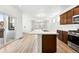 Modern kitchen boasts a large island, stainless steel appliances, and an open layout perfect for entertaining at 2070 Wagon Wheel Aly, Brighton, CO 80601