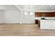 Open-concept living area featuring wood floors, recessed lighting, and seamless flow into the kitchen at 2070 Wagon Wheel Aly, Brighton, CO 80601