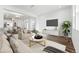 A combined living and dining area offering a bright space with hardwood floors and neutral colors at 2070 Wagon Wheel Aly, Brighton, CO 80601
