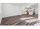 Open living room with wood-look flooring, recessed lighting, and easy access to the kitchen at 2070 Wagon Wheel Aly, Brighton, CO 80601