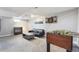 Finished basement with a dart board, foosball table, and comfortable seating area at 7624 Navajo St, Denver, CO 80221