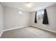 Bedroom featuring carpet, natural light, and a neutral wall color at 7624 Navajo St, Denver, CO 80221