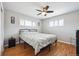 Bright bedroom with hardwood floors, neutral walls, and a ceiling fan at 7624 Navajo St, Denver, CO 80221