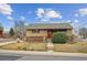 Charming single-story brick home with a well-maintained front yard and inviting curb appeal at 7624 Navajo St, Denver, CO 80221