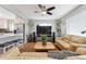 Open-concept living room showcasing hardwood floors, neutral walls, and access to the kitchen at 7624 Navajo St, Denver, CO 80221