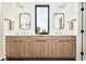 Stylish bathroom features a double vanity with modern sinks and mirrors at 4398 N Pecos St, Denver, CO 80211