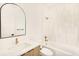 Modern bathroom features a vanity with elegant mirror and a tiled shower at 4398 N Pecos St, Denver, CO 80211