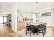 Open concept dining area flowing into a modern kitchen and cozy living space at 4398 N Pecos St, Denver, CO 80211