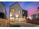 Charming home boasts a modern design with stucco and brickwork, complemented by ample windows and stylish lighting at 4398 N Pecos St, Denver, CO 80211