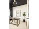 Bright home office boasts a black slat ceiling, modern art, and natural light at 4398 N Pecos St, Denver, CO 80211