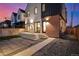 Modern home with a patio, concrete steps, and a combination of stucco and brick exterior at 4398 N Pecos St, Denver, CO 80211