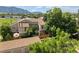 Aerial view of the property featuring mature trees and mountain views at 4717 Tantra Dr # G5, Boulder, CO 80305