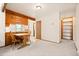 Kitchen nook with wooden cabinets, a breakfast bar, and a cozy dining area at 4717 Tantra Dr # G5, Boulder, CO 80305