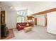 Comfortable living room featuring vaulted ceilings, a brick fireplace, and natural light at 4717 Tantra Dr # G5, Boulder, CO 80305