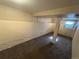 Unfinished basement with a support beam and a small window in this home at 7810 Pontiac St, Commerce City, CO 80022
